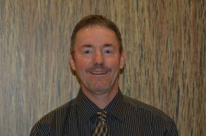 Dr. Brett Comstock smiling